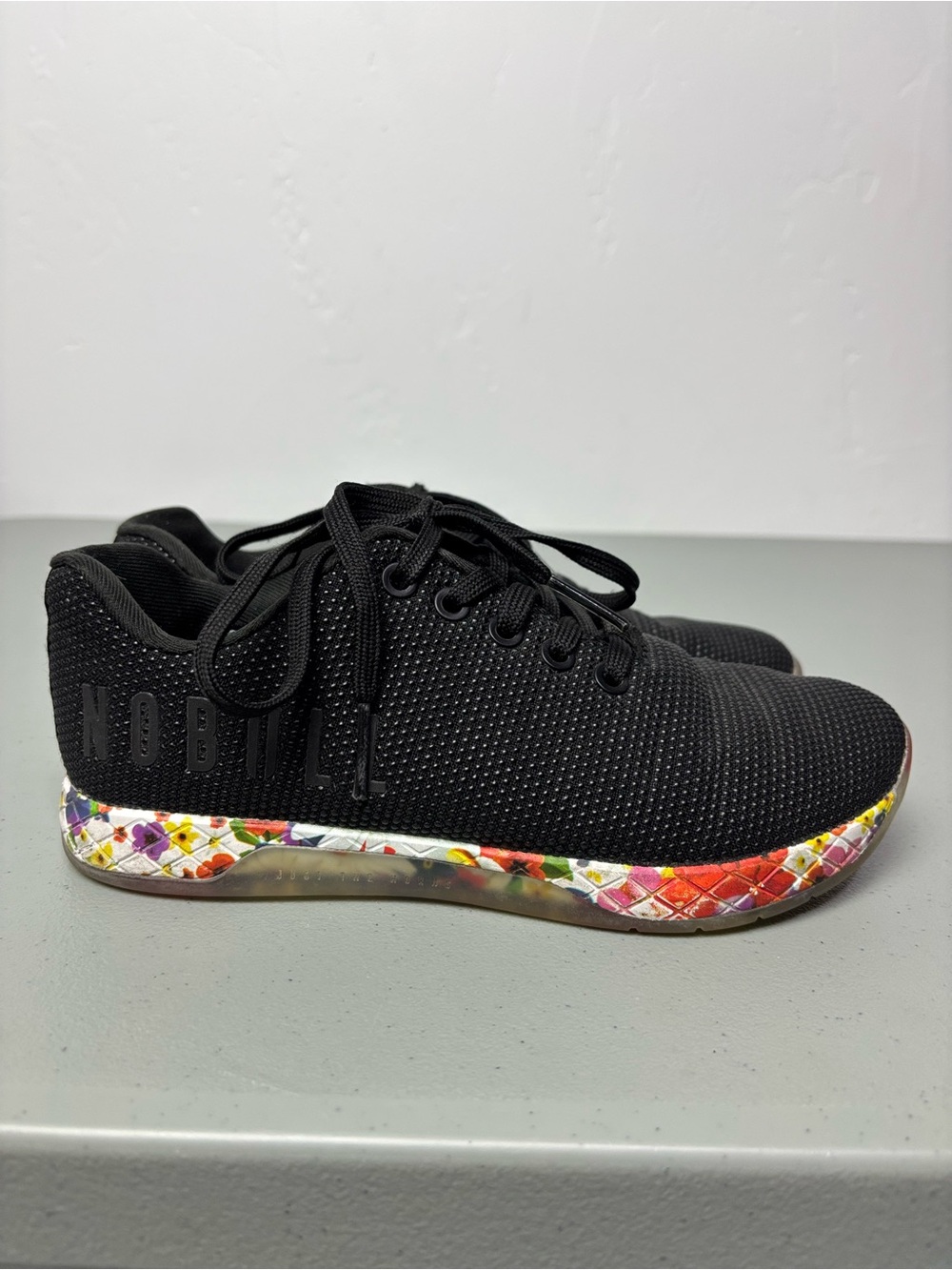 NOBULL Women's Black Athletic Trainer with Floral Accent Midsole 6.5